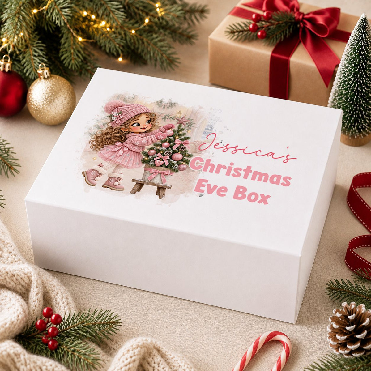 Personalised Christmas Eve box, white magnetic gift box printed with a blonde girl in a pink coat carrying pink presents through the snow and the name Sophie