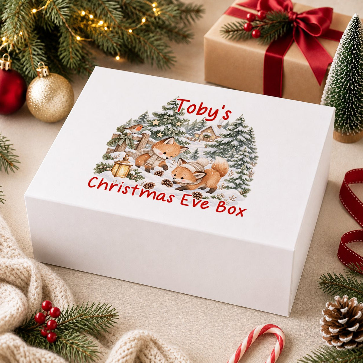 Personalised Christmas Eve box, white magnetic gift box printed with a snowman in a sage hat with a baby deer and bunny in a snowy wood and the name Ethan