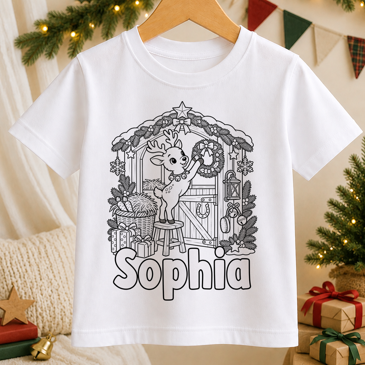 Personalised Christmas colour-in kids t-shirt with a black and white Reindeer Christmas Stable line art design and a name in bubble letters to colour in
