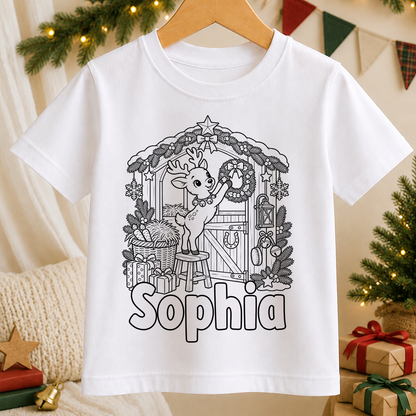 Personalised Christmas colour-in kids t-shirt with a black and white Reindeer Christmas Stable line art design and a name in bubble letters to colour in