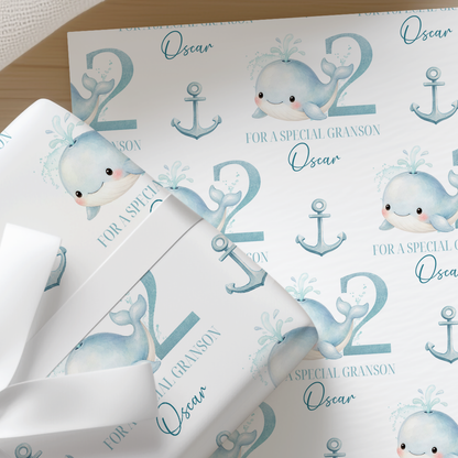 Personalised whale and anchor wrapping paper example printed with the name Oscar and age 2