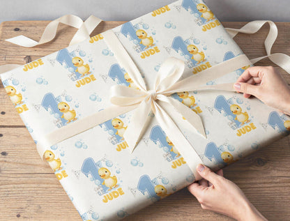 Gift wrapped in the personalised duck wrapping paper, tied with ribbon.