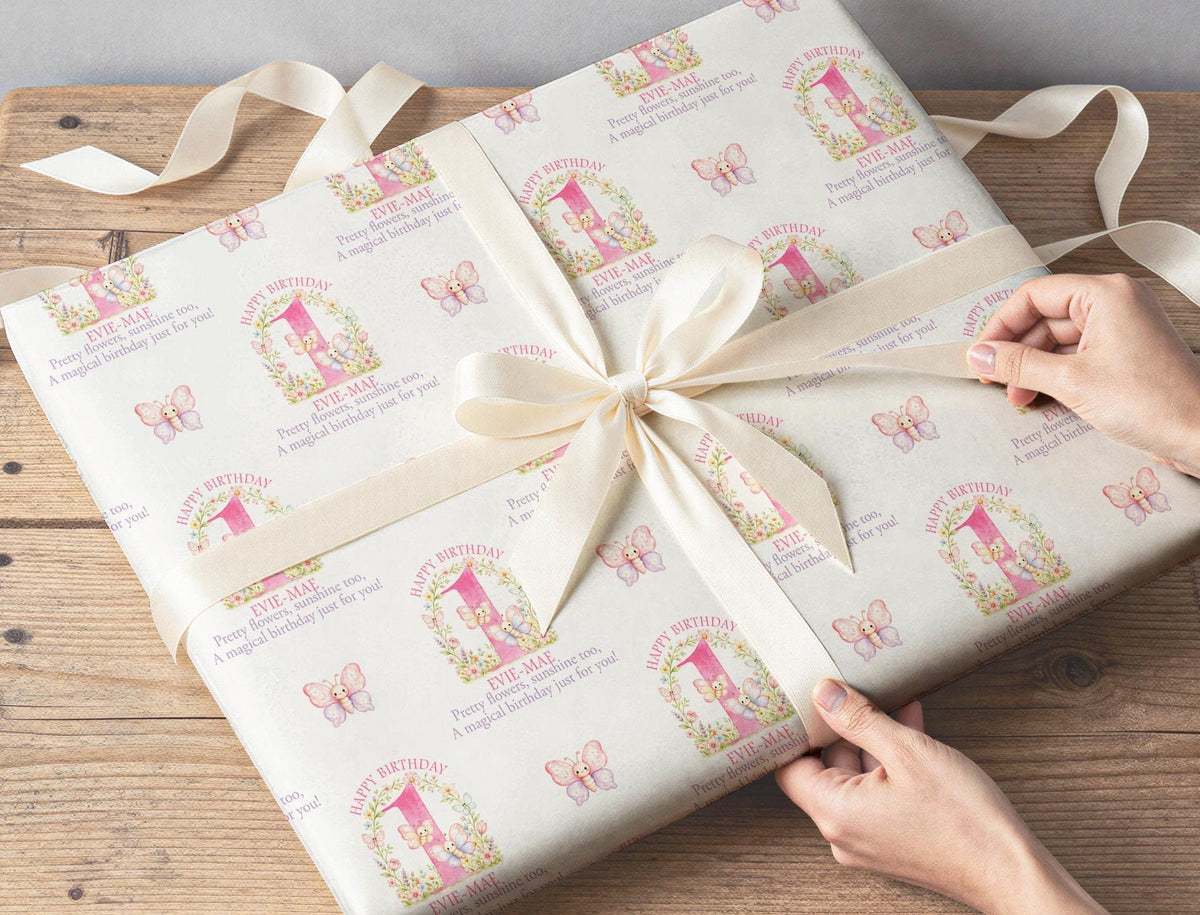 Personalised pink floral butterfly wrapping paper shown in full pattern repeat.
