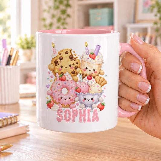Personalised kawaii mug with pink handle and inside, printed with smiling cookie, cupcake, milkshake, pink doughnut and ice cream above a name in pink