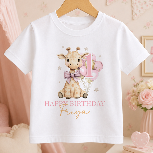 White kids t-shirt with a pink giraffe and balloons design, personalised with a birthday message and name