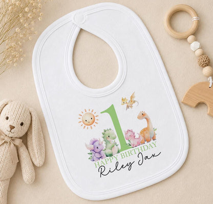 Personalised dinosaur first birthday bib with Happy Birthday Riley Jax