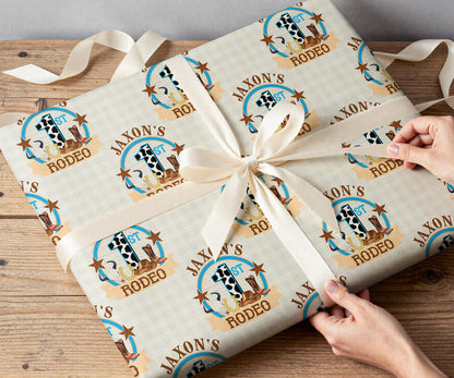 Personalised cowboy wrapping paper rolled and shown against a plain background