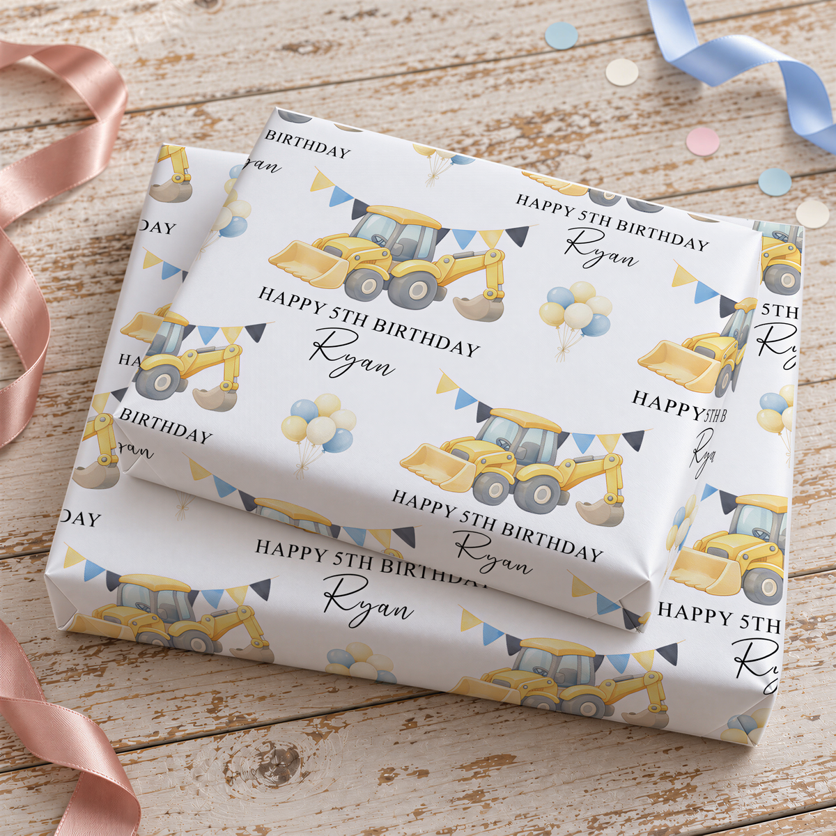 a set of gift wrapping paper with a construction vehicle theme, including a yellow bulldozer and construction equipment. The wrapping paper has the text "Happy 5th Birthday Ryan" printed on it, indicating it is a birthday gift for someone named Ryan.