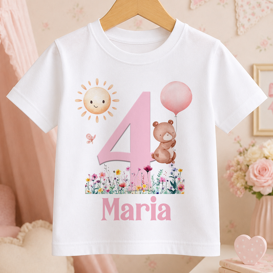 White cotton t-shirt with a pink number and bear holding a balloon design, personalised with a child's name and birthday age