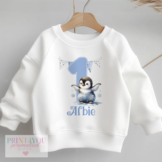 Personalised blue penguin first birthday sweatshirt with custom name, baby size 6-12 months