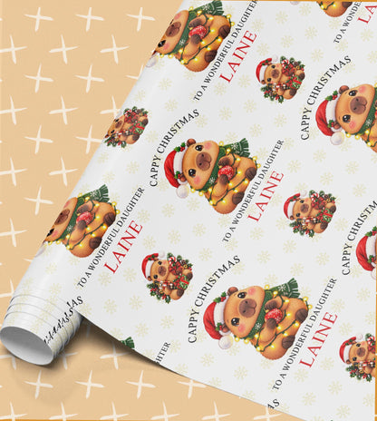 Personalised Cappy Christmas wrapping paper roll – capybara in fairy lights and a Santa hat with To a Wonderful Daughter Laine