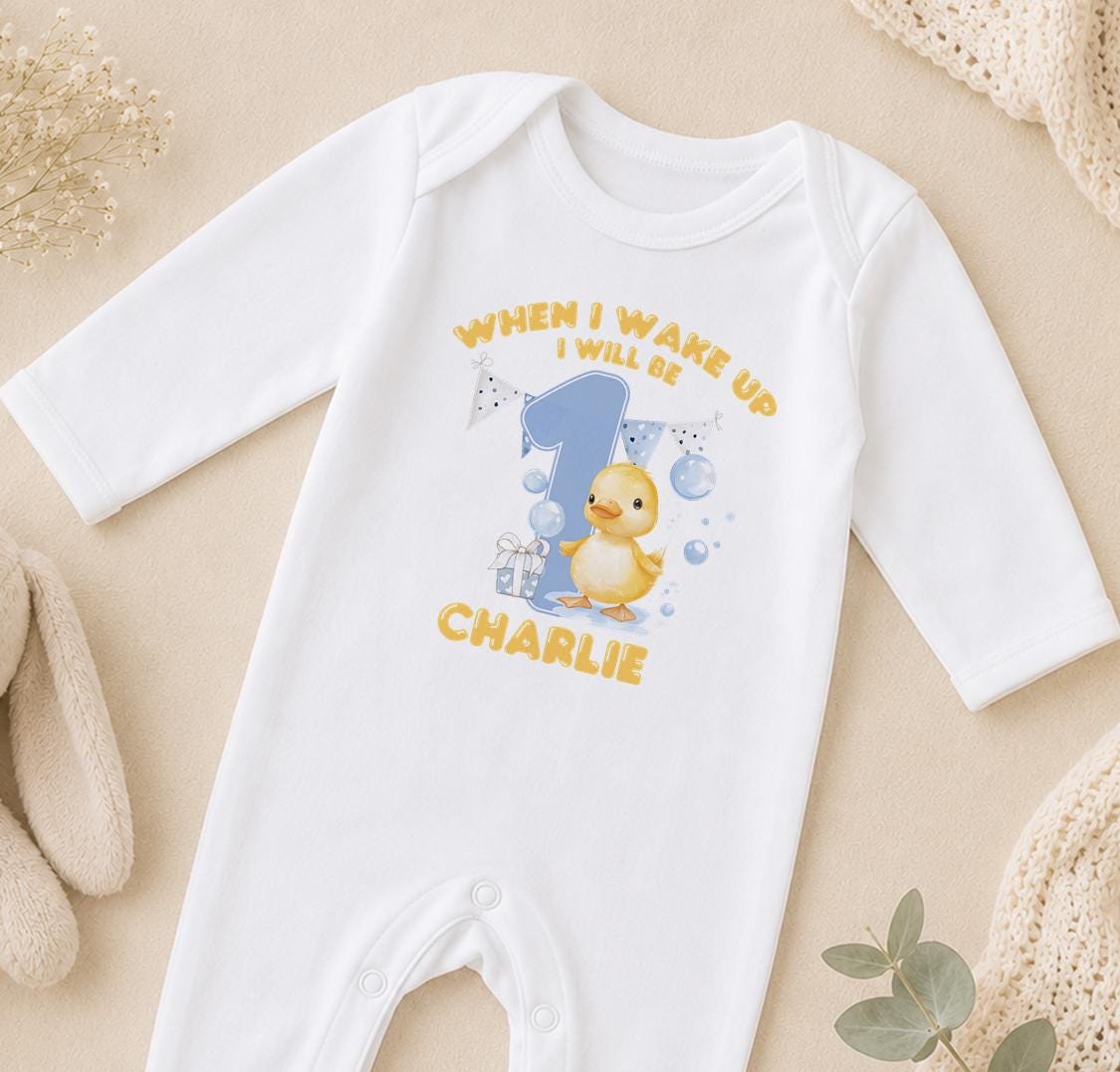 Personalised When I Wake Up I Will Be 1 sleepsuit – yellow duckling, blue number 1 and the name Charlie