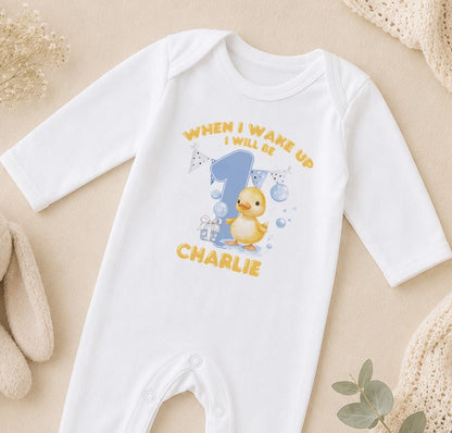 Personalised When I Wake Up I Will Be 1 sleepsuit – yellow duckling, blue number 1 and the name Charlie