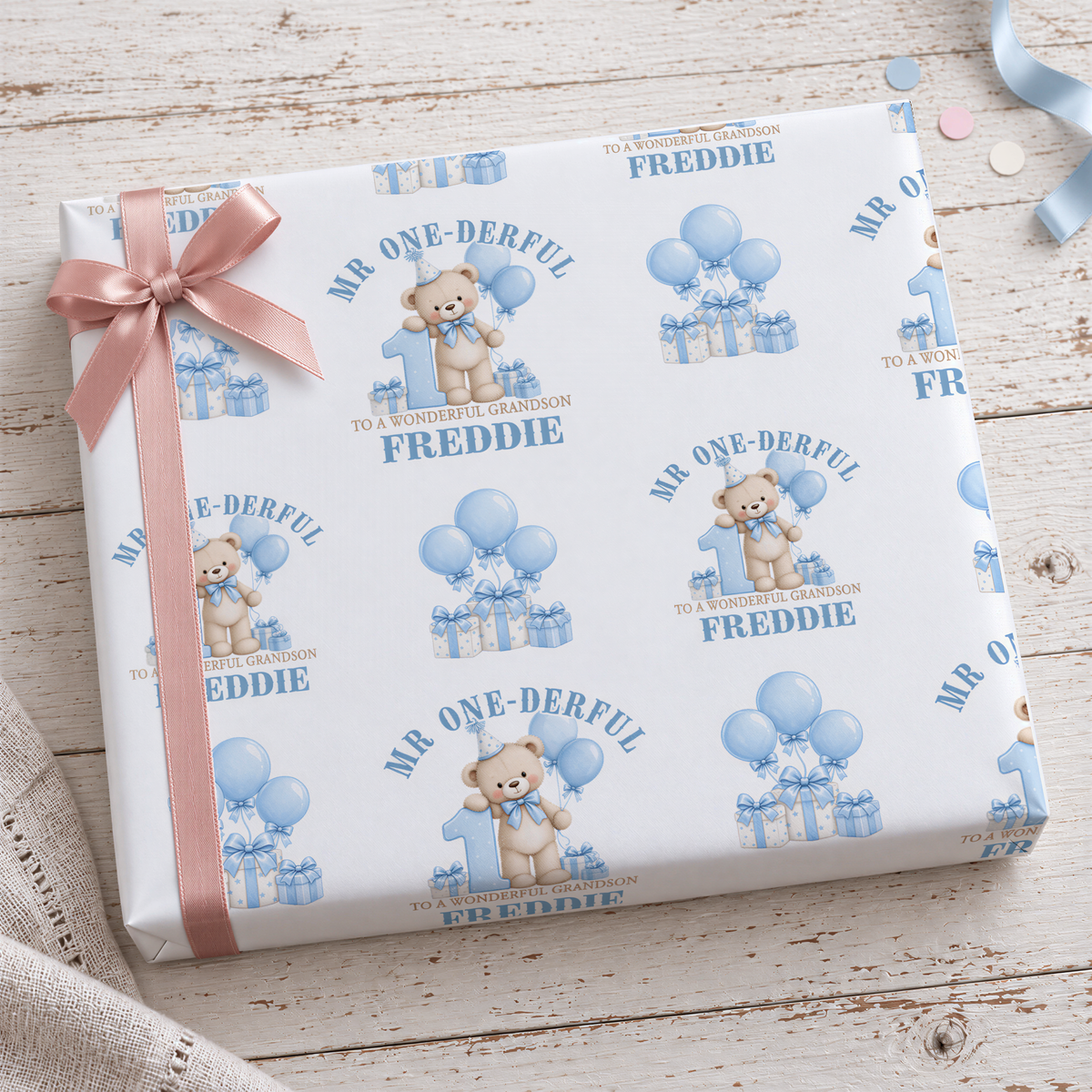 a gift box with a repeating pattern of a teddy bear wearing a party hat and holding a balloon, along with the text "Mr. One-Derrful" and "Mr. One-Derrful is a wonderful grandfather".