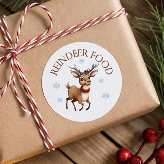 Glossy round Christmas gift sticker, showing a brown reindeer in a red scarf surrounded by snowflakes, stuck on a brown reindeer food gift box