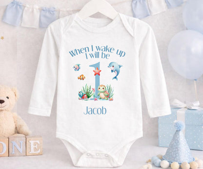 Personalised under the sea first birthday pyjamas with custom name and ocean design.