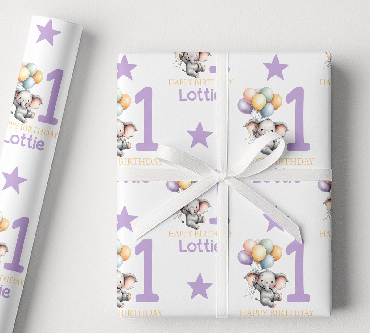 Close-up detail of the purple elephant design on personalised 1st birthday wrapping paper