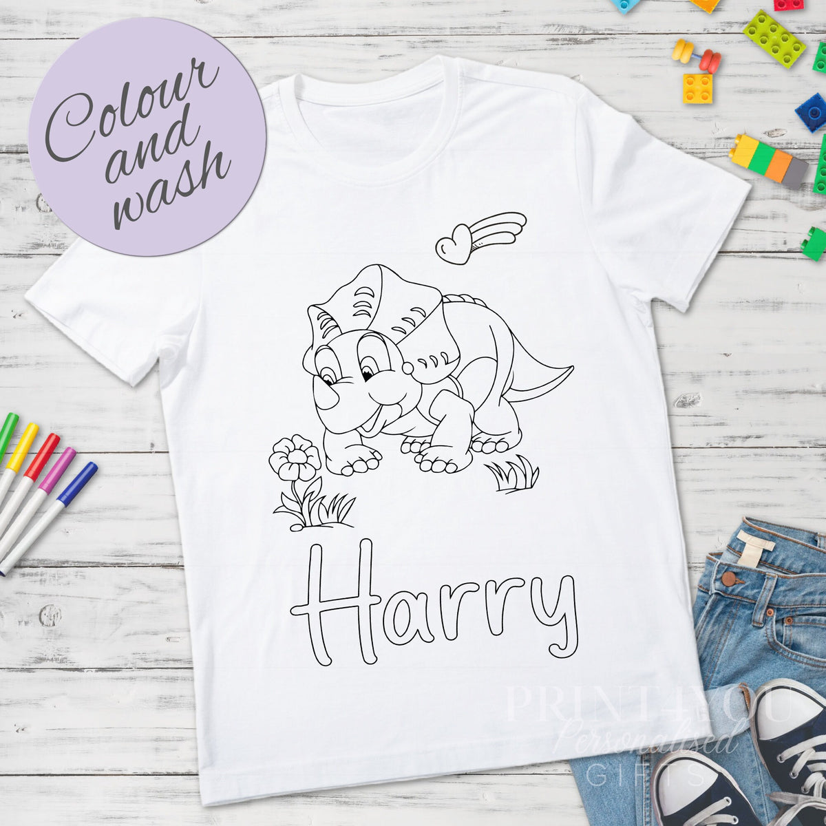 Personalised dinosaur colour-in kids t-shirt with washable pens, size 1-2 years, close-up of design