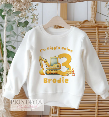 Personalised digger birthday t-shirt with dumper truck print and custom name and age, size 6-12 months