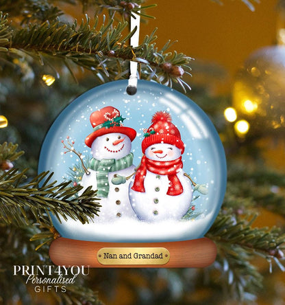 Personalised acrylic Christmas bauble featuring Snowman and Snowlady together with custom name
