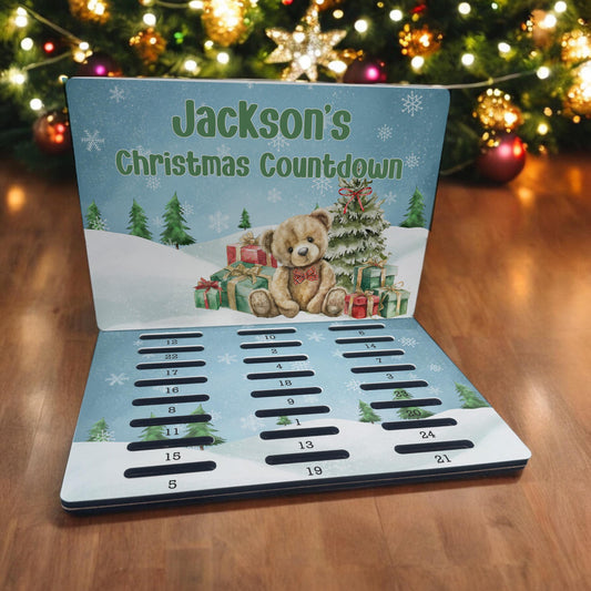 Personalised A5 MDF advent calendar countdown board featuring a teddy bear and Christmas tree design with a custom name printed across the front