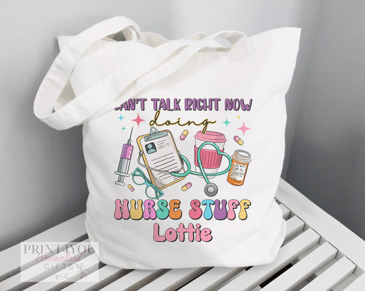 White cotton tote bag personalised with a nurse's name, printed with a Highland Cow design