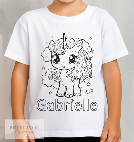 Child wearing a personalised colour-in unicorn t-shirt with custom name printed on the front, ready to colour with washable pens, 1-2 years
