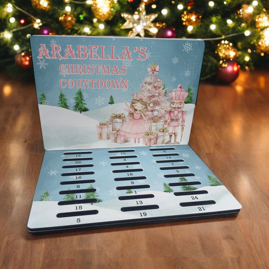 Personalised A5 MDF advent calendar countdown board featuring a pink nutcracker design with a custom name printed across the front