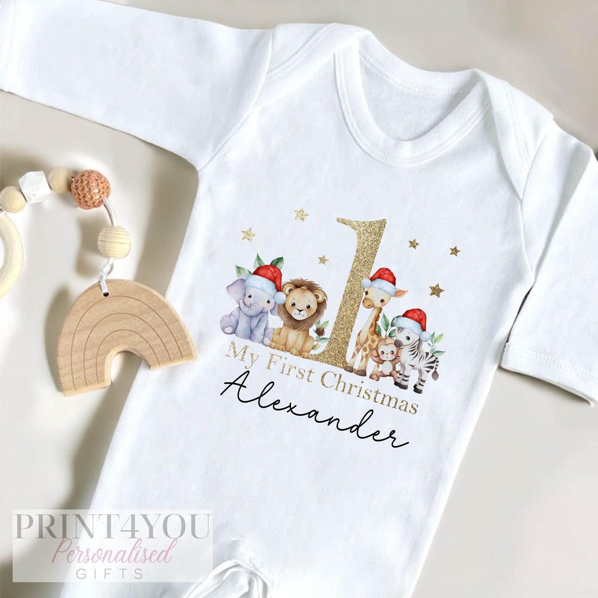 Personalised first Christmas gold-effect safari jungle bib in soft white cotton.