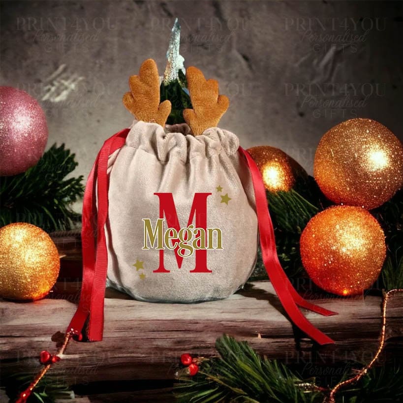 Personalised velvet reindeer Christmas Eve gift bag with custom name and red ribbon drawstring