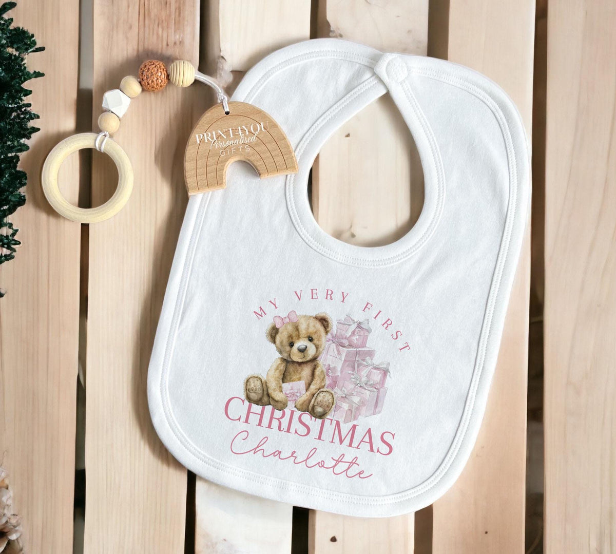 Close-up of baby's first Christmas print with custom name on soft cotton