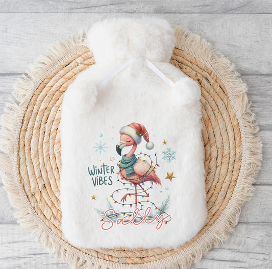 Personalised Christmas hot water bottle with a fluffy polyester cover and custom name printed on the front.