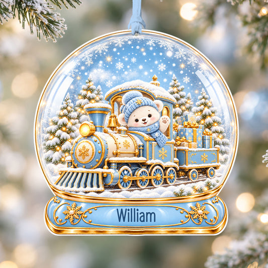 Personalised blue and gold train acrylic snow globe Christmas bauble with custom name, hanging on a Christmas tree with baby blue ribbon