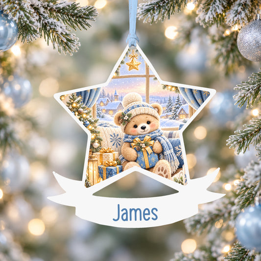 Personalised blue Christmas window acrylic star Christmas bauble with custom name, hanging on a Christmas tree with baby blue ribbon