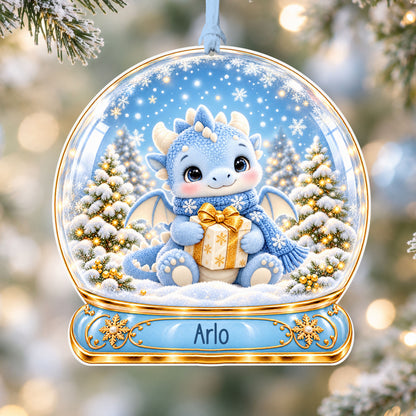 Personalised blue dragon acrylic snow globe Christmas bauble with custom name, hanging on a Christmas tree with baby blue ribbon