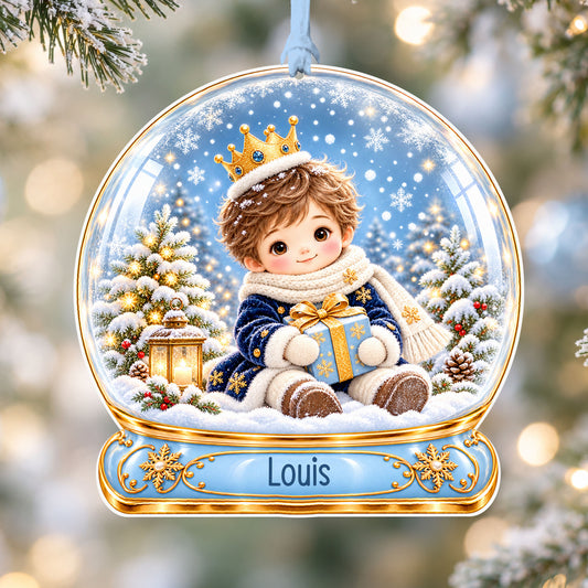 Personalised blue snow prince acrylic snow globe Christmas bauble with custom name, hanging on a Christmas tree with baby blue ribbon