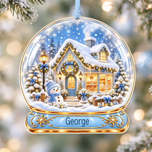Personalised blue winter bakery acrylic snow globe Christmas bauble with custom name, hanging on a Christmas tree with baby blue ribbon
