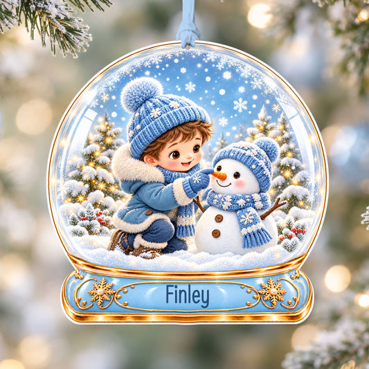 Personalised boy building a snowman acrylic snow globe Christmas bauble with custom name, hanging on a Christmas tree with baby blue ribbon