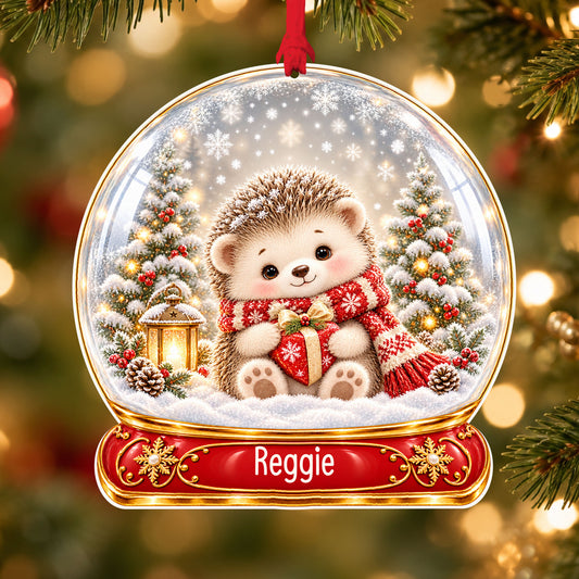 Personalised Christmas hedgehog acrylic snow globe Christmas bauble with custom name, hanging on a Christmas tree with red ribbon