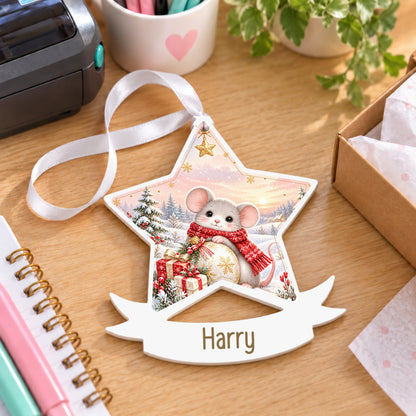 Personalised Christmas mouse white acrylic star bauble with name, 10cm Christmas decoration with ribbon, shown on a desk