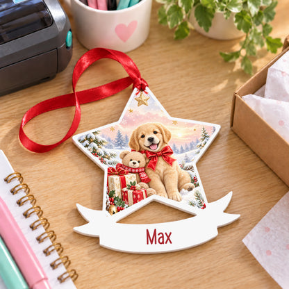 Personalised Christmas puppy white acrylic star bauble with name, 10cm Christmas decoration with ribbon, shown on a desk