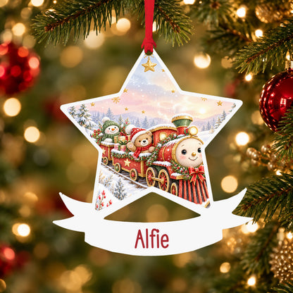 Personalised classic Christmas train acrylic star Christmas bauble with custom name, hanging on a Christmas tree with red ribbon