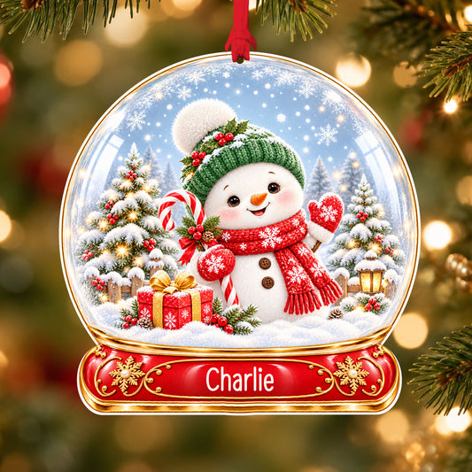 Personalised classic snowman acrylic snow globe Christmas bauble with custom name, hanging on a Christmas tree with red ribbon