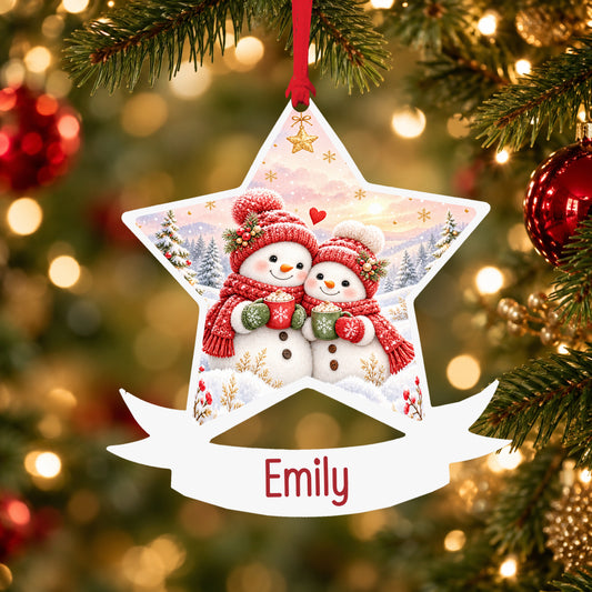 Personalised cosy snowman couple acrylic star Christmas bauble with custom name, hanging on a Christmas tree with red ribbon