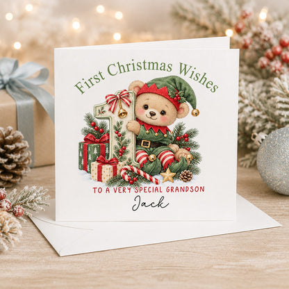 Personalised 6x6 First Christmas Wishes card with a little teddy dressed as one of Santa’s elves peeping out from behind a festive number 1, “To a very special grandson Jack”