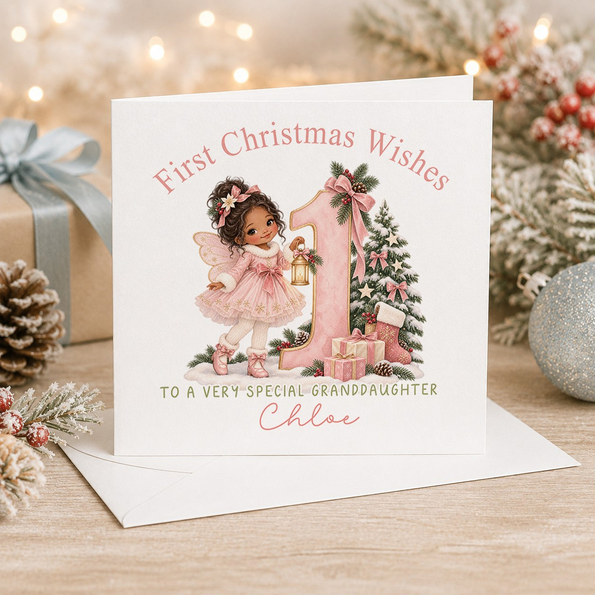 Personalised 6x6 First Christmas Wishes card with a little fairy with dark curly hair holding a glowing lantern beside a big pink number 1, “To a very special granddaughter Chloe”