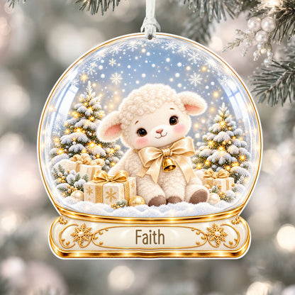 Personalised ivory lamb acrylic snow globe Christmas bauble with custom name, hanging on a Christmas tree with white ribbon