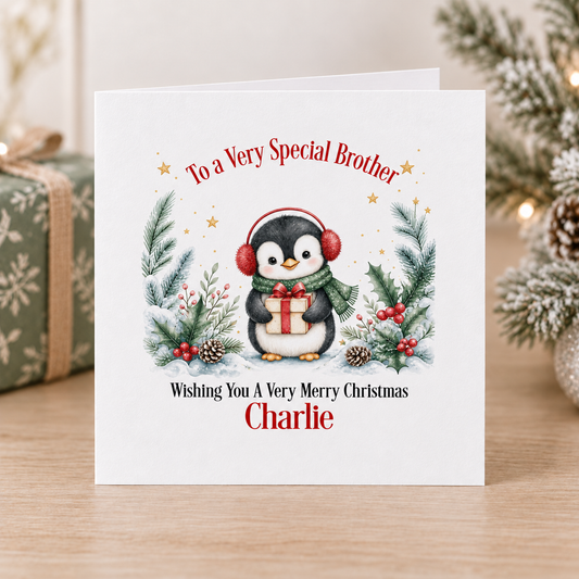 Personalised Penguin Christmas Card for Brother – Red Earmuffs & Present, 6x6
