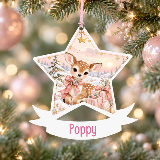 Personalised pink Christmas fawn acrylic star Christmas bauble with custom name, hanging on a Christmas tree with baby pink ribbon