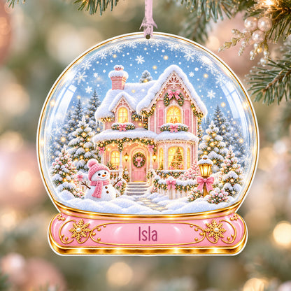 Personalised pink Christmas house acrylic snow globe Christmas bauble with custom name, hanging on a Christmas tree with baby pink ribbon